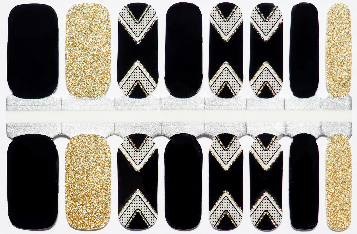 Semi-transparent multicolor nail wraps with black and gold chevron accents.