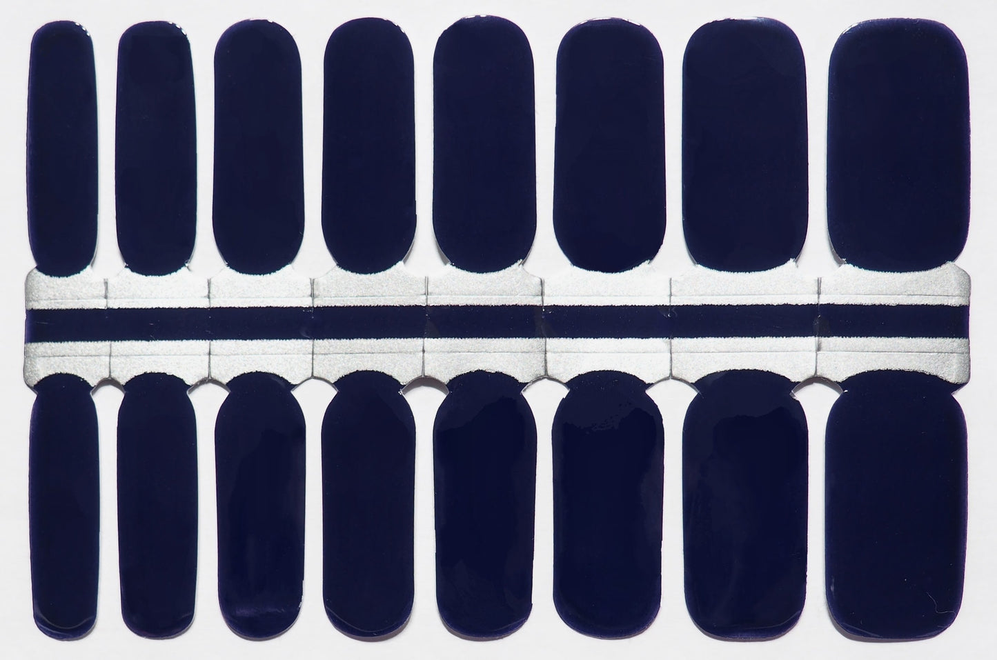 Deep navy blue nail wraps.