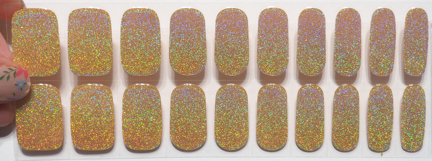 A magical rainbow shimmer on these gold gel nail wraps