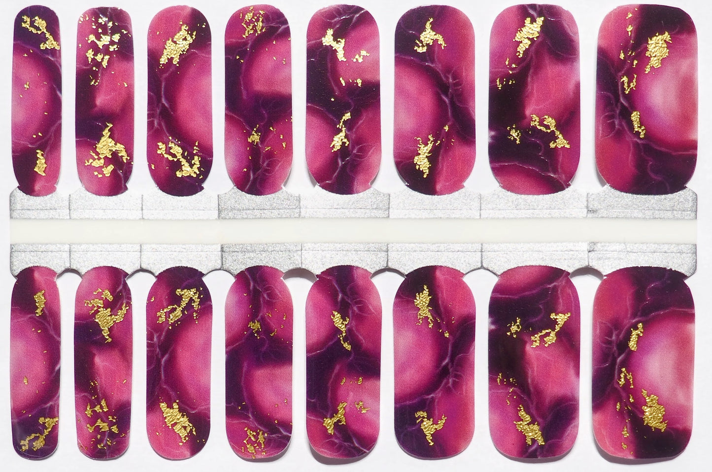 Purple marble-patterned nail wraps with gold flecks for a regal look.
