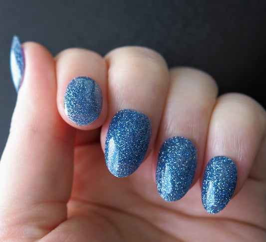 front view of Starfall, an enchanting blue glitter semi-cured gel nail wrap