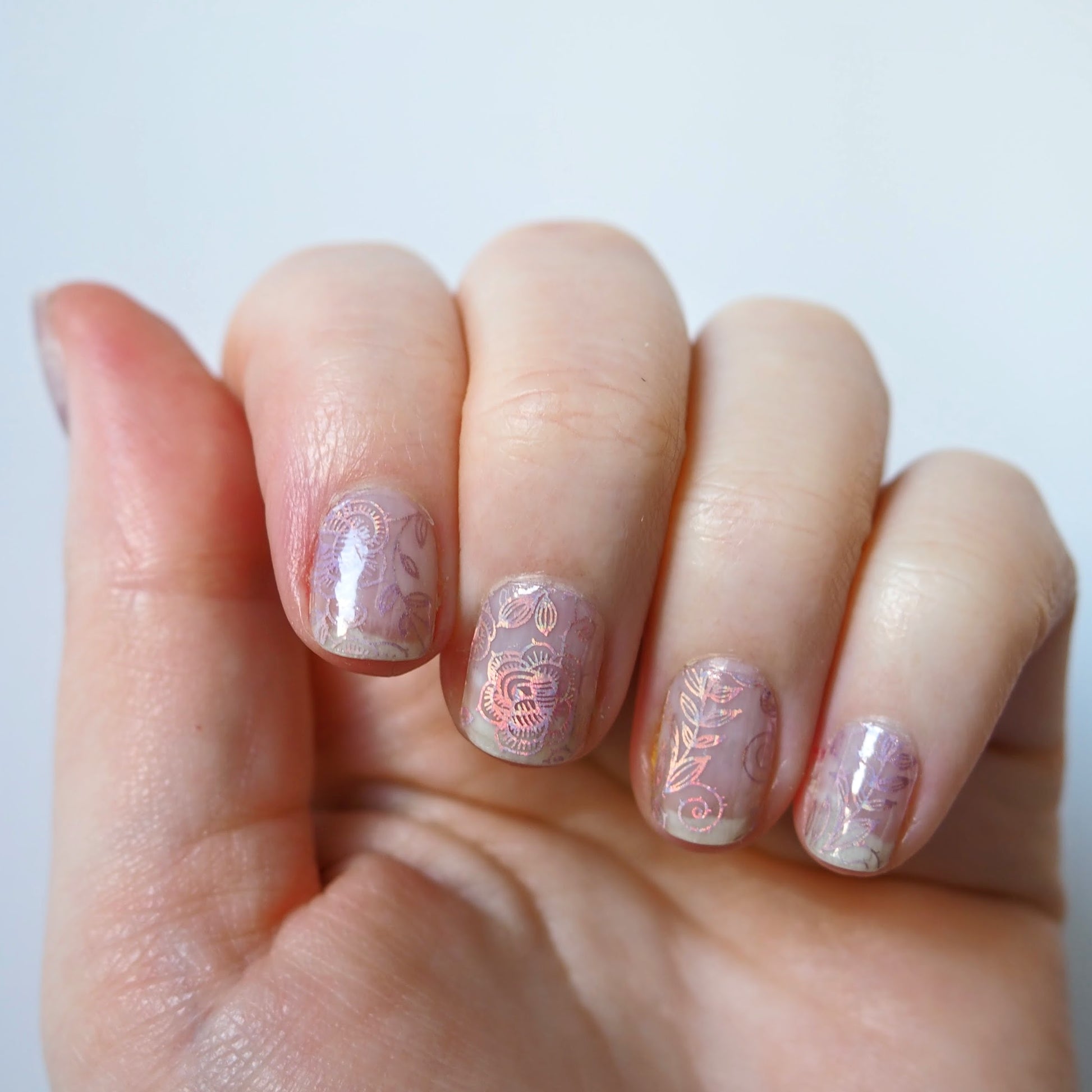 Subtle but beautiful iridescent rose pattern over natural nails.