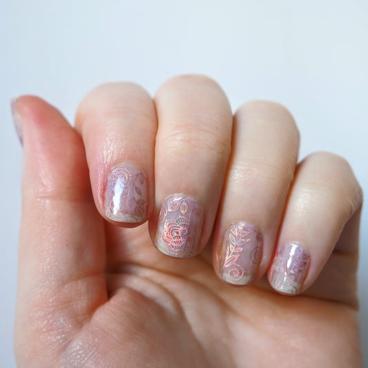 Subtle but beautiful iridescent rose pattern over natural nails.