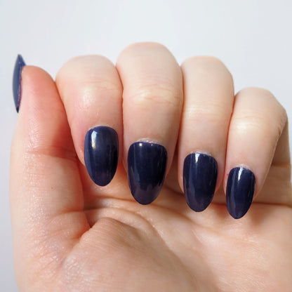 Deep navy blue nail wraps with a glossy gel-like finish.