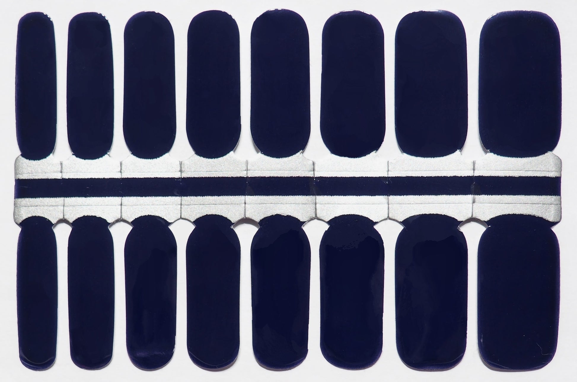 Deep navy blue nail wraps.