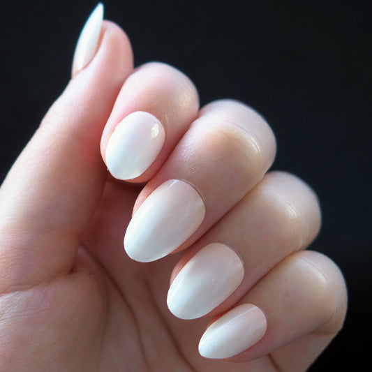 Front view of peach to white ombre nails