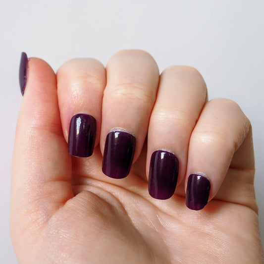 Rich plum purple nail wraps with a glossy finish.