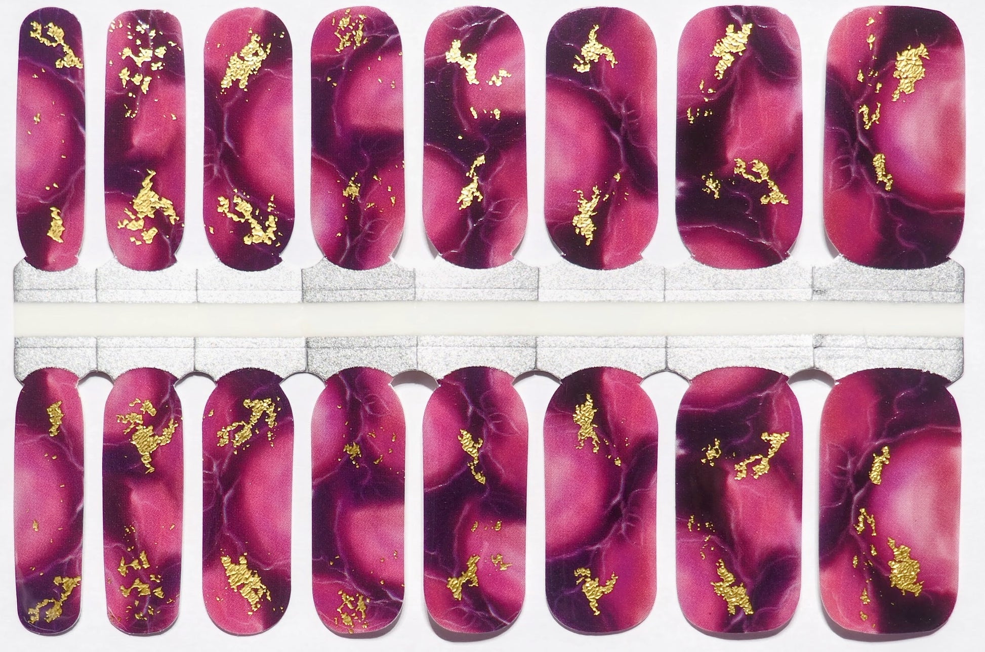 Purple marble-patterned nail wraps with gold flecks for a regal look.